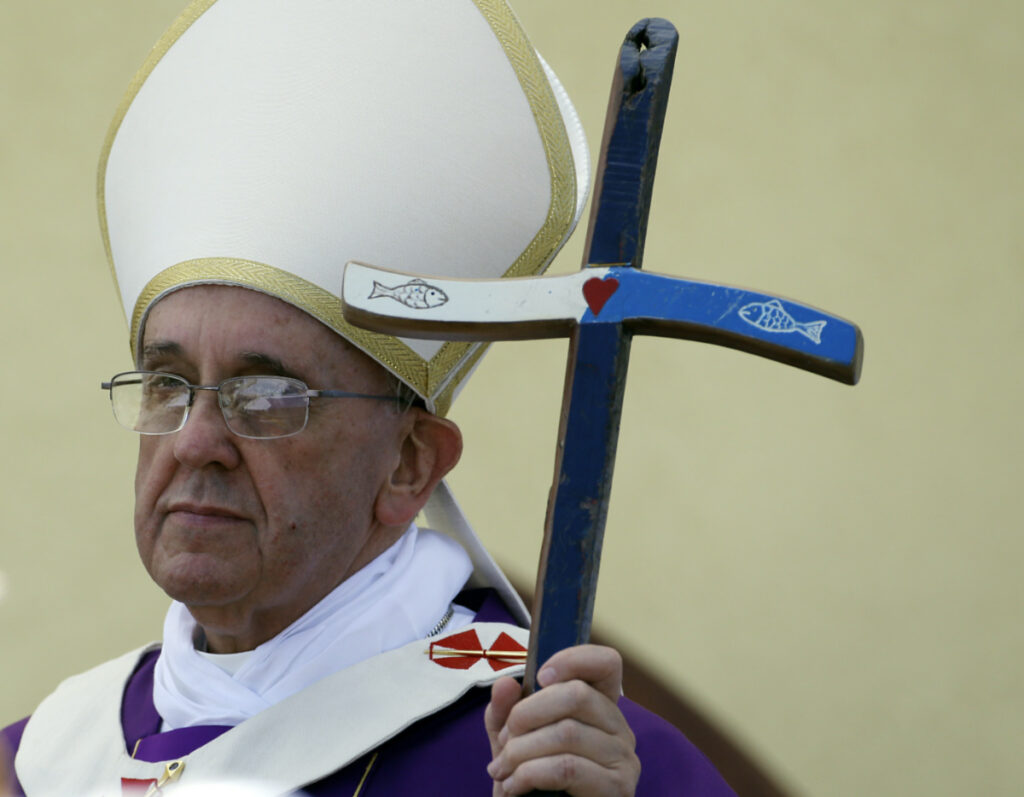 Pope Francis holds his pastoral staff, made from recycled wood from broken migrant boats, at the end of a Mass during his visit to the island of Lampedusa, southern Italy, Monday on 8th July, 2013