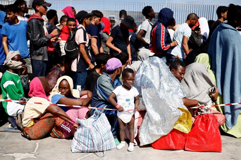 Migrants wait at the port to be transferred to the mainland, on the Sicilian island of Lampedusa, Italy, on 14th September, 2023.