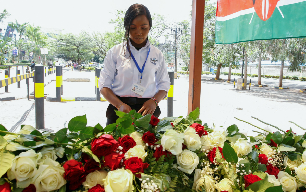 Jackline Maina, a private security guard pays homage after placing a rose outside the Westgate shopping mall, on the 10th commemoration since the Somali militant group al-Shabaab attacked the mall killing at least 67 people, in Nairobi, Kenya, on 21st September, 2023.