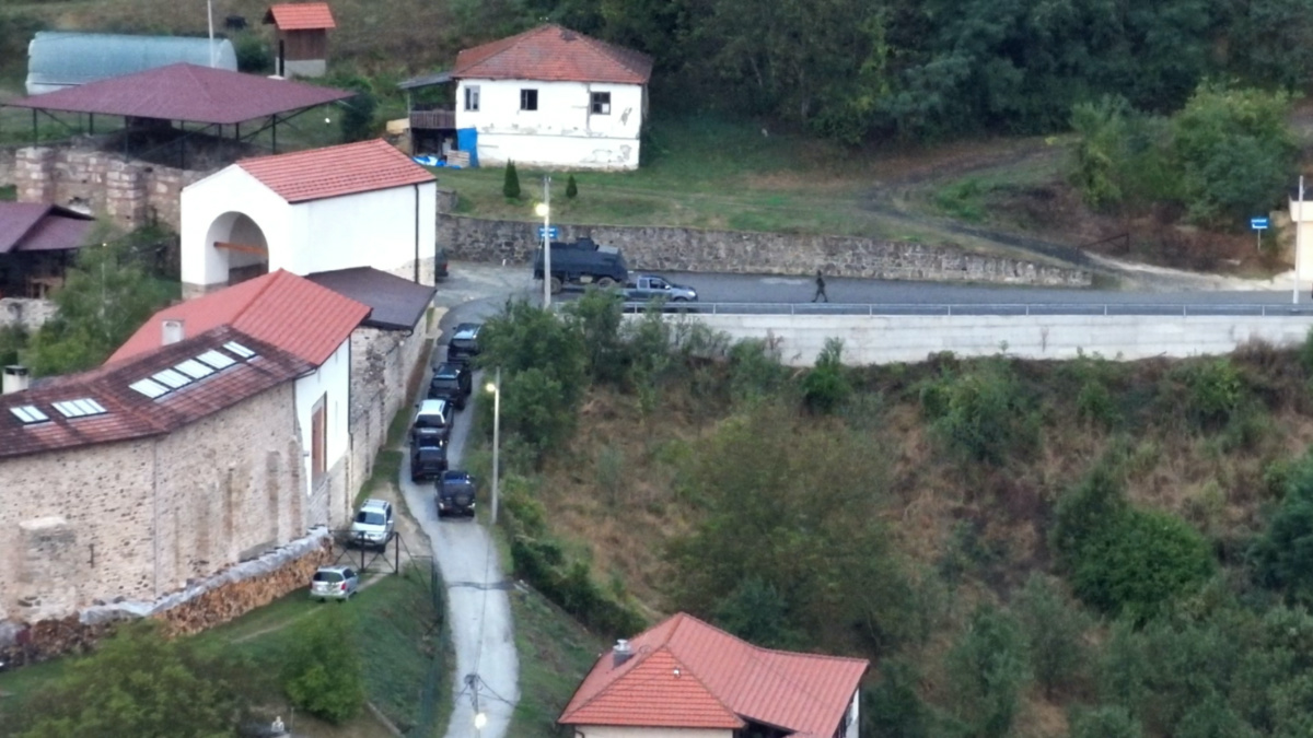 A view shows unmarked vehicles lined up outside Banjska Monastery, in Kosovo, in this handout picture released on 24th September, 2023.  
