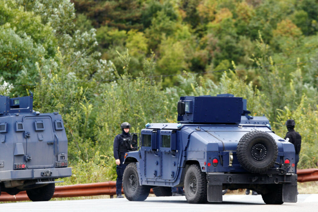 Kosovo police officers patrol a road to Banjska monastery, in the aftermath of a shooting incident, near Zvecan, Kosovo, on 25th September, 2023