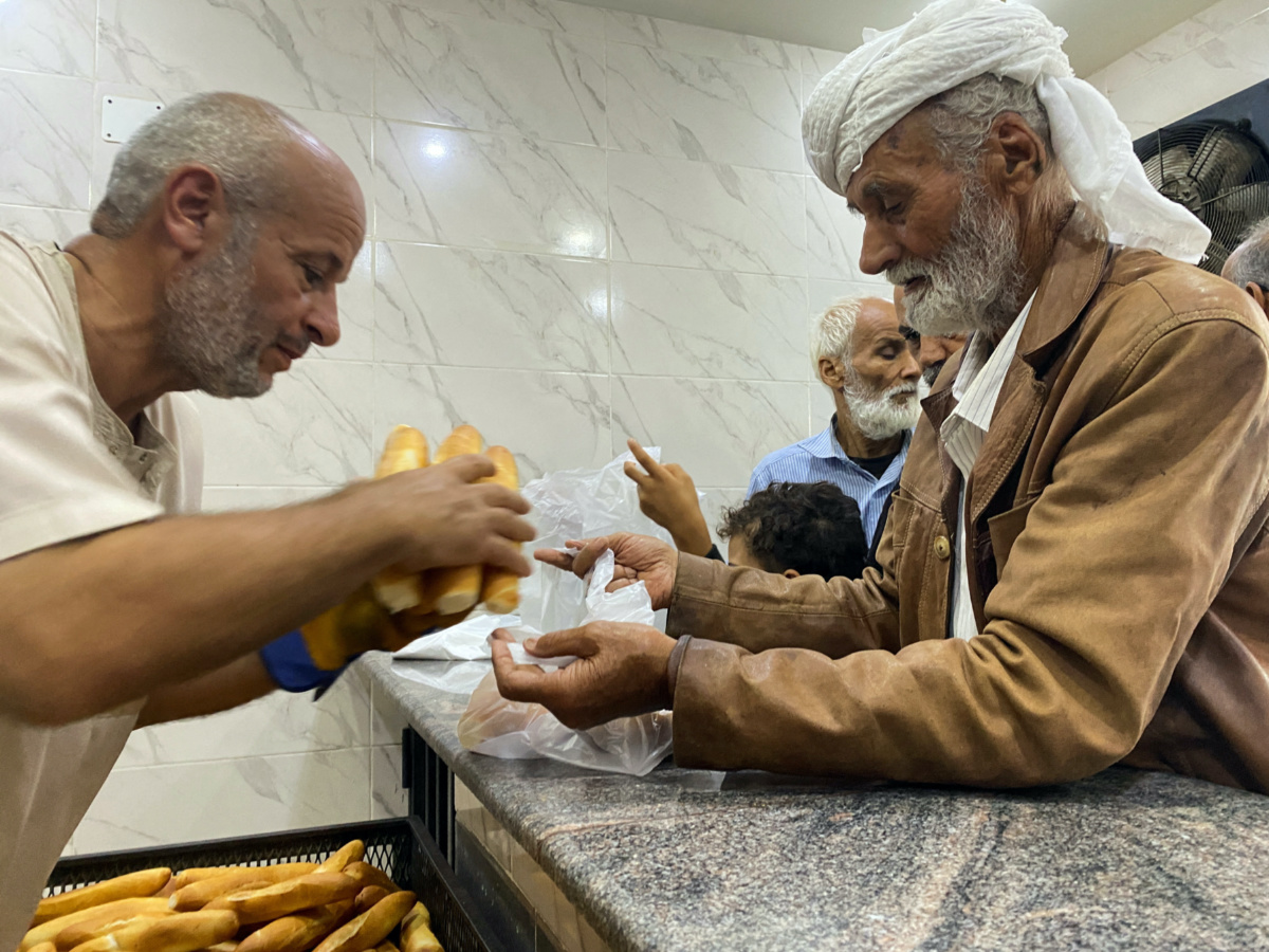 People get bread from a bakery, in the aftermath of the floods in Derna, Libya, on 15th September, 2023
