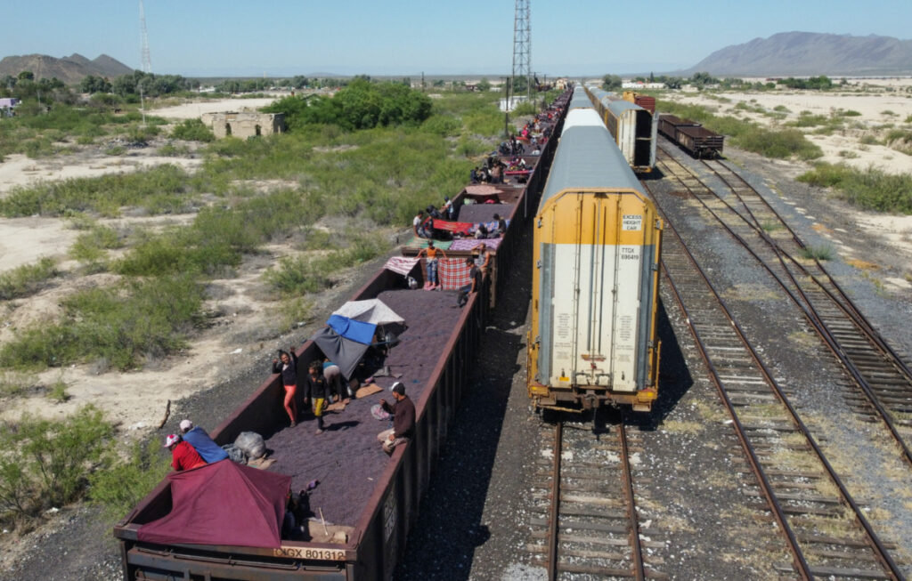 Asylum seekers heading to the US travel aboard a train after thousands of migrants have already crossed into the United States in recent days, in Paredon, Mexico, on 21st September, 2023