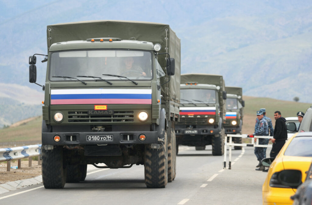 Vehicles of Russian peacekeepers leaving Azerbaijan's Nagorno-Karabakh region for Armenia pass an Armenian checkpoint on a road near the village of Kornidzor, Armenia, on 22nd September, 2023.