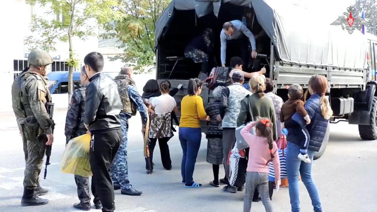 Russian peacekeepers evacuate civilians in the town of Askeran following the launch of a military operation by Azerbaijani forces in the region of Nagorno-Karabakh, a region inhabited by ethnic Armenians, in this still image from video published on 20th September, 2023.