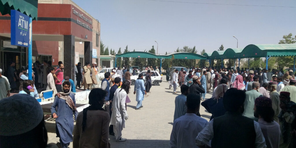 People gather outside the Mastung hospital, following a deadly suicide attack on a religious gathering in Balochistan province, Pakistan, on 29th September, 2023 in this handout image