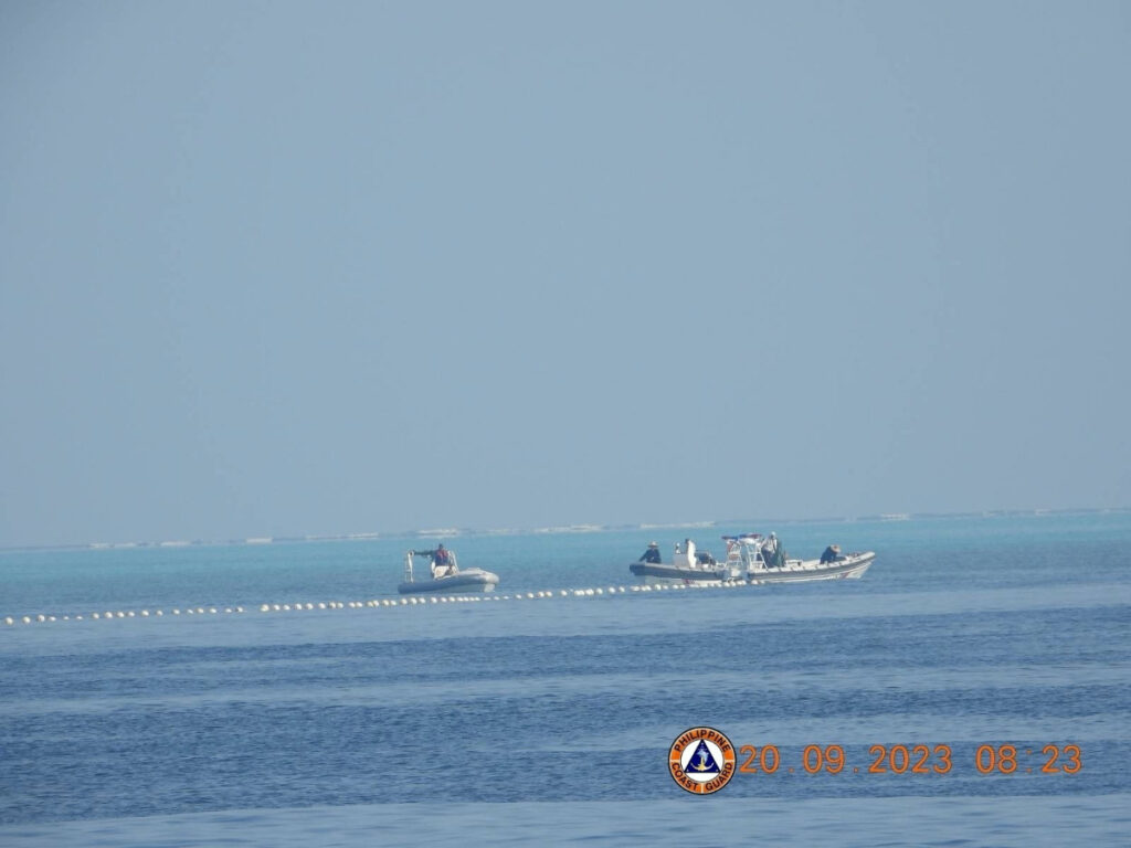 Chinese Coast Guard boats close to the floating barrier are pictured on 20th September, 2023, near the Scarborough Shoal in the South China Sea, in this handout image released by the Philippine Coast Guard on 24th September, 2023.