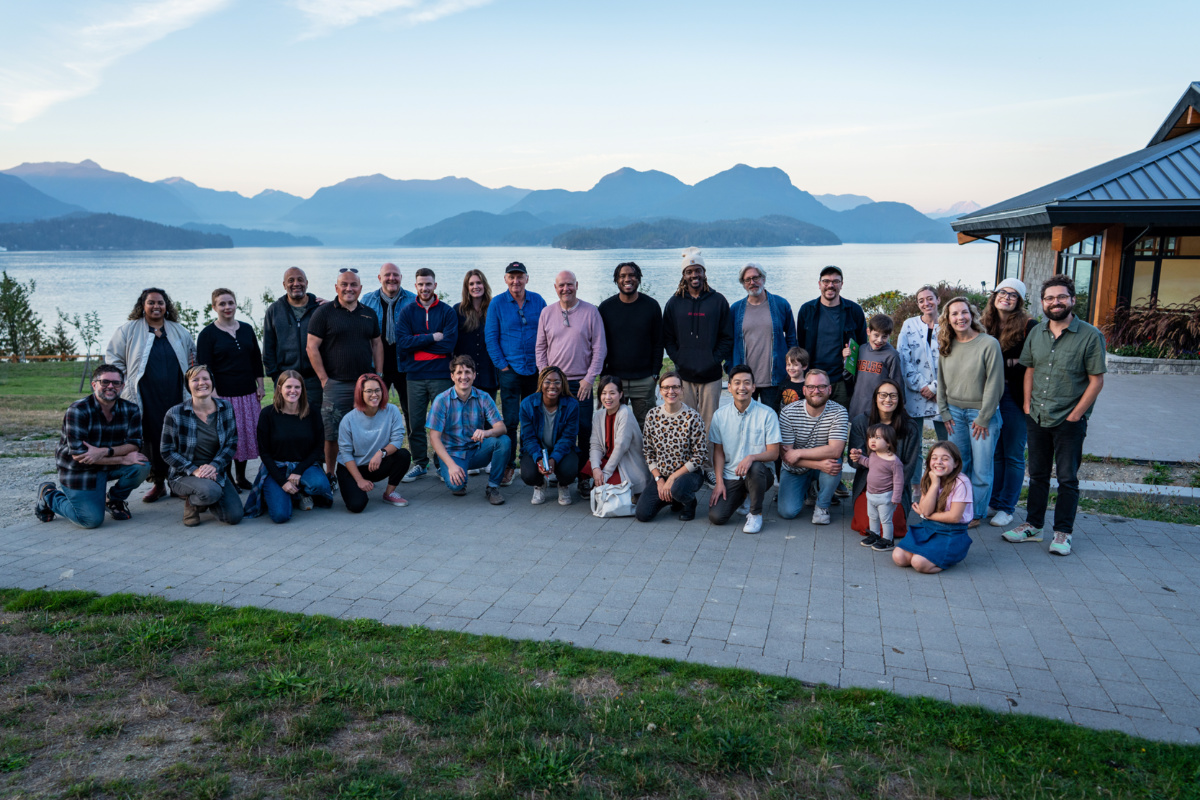 Attendees of the album-writing retreat brought nearly 50 people, not all pictured, to an island off the coast of Vancouver to collaborate and write the twelve-track album. 