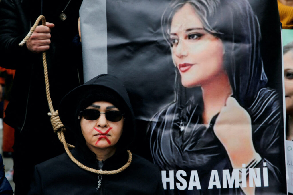 A woman takes part in a protest against the Islamic regime of Iran following the death of Mahsa Amini, in Istanbul, Turkey, on 10th December, 2022