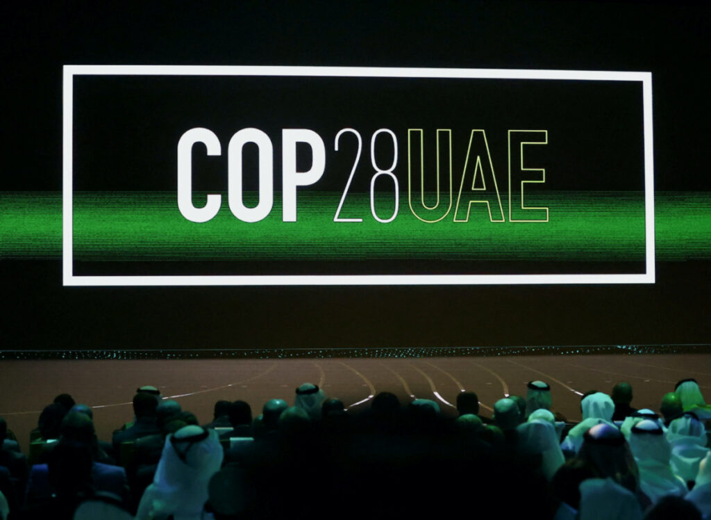 'Cop28 UAE' logo is displayed on the screen during the opening ceremony of Abu Dhabi Sustainability Week under the theme of 'United on Climate Action Toward COP28', in Abu Dhabi, UAE, on 16th January, 2023.
