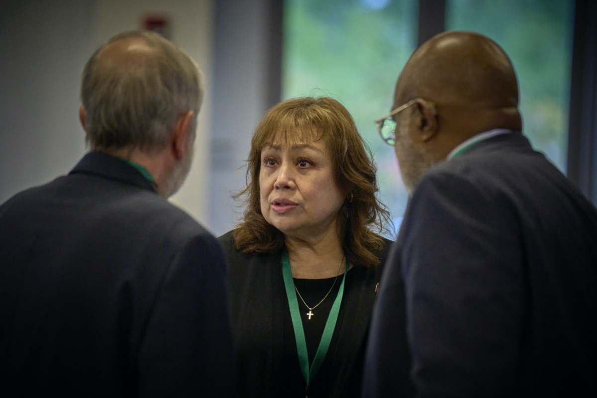 In this photo provided by UM News, United Methodist Bishop Minerva G Carcano, centre, talks with counsel, Rev Scott Campbell, left, and Judge Jon Gray during her church trial on 19th September, 2023, in Glenview, Illinois, US