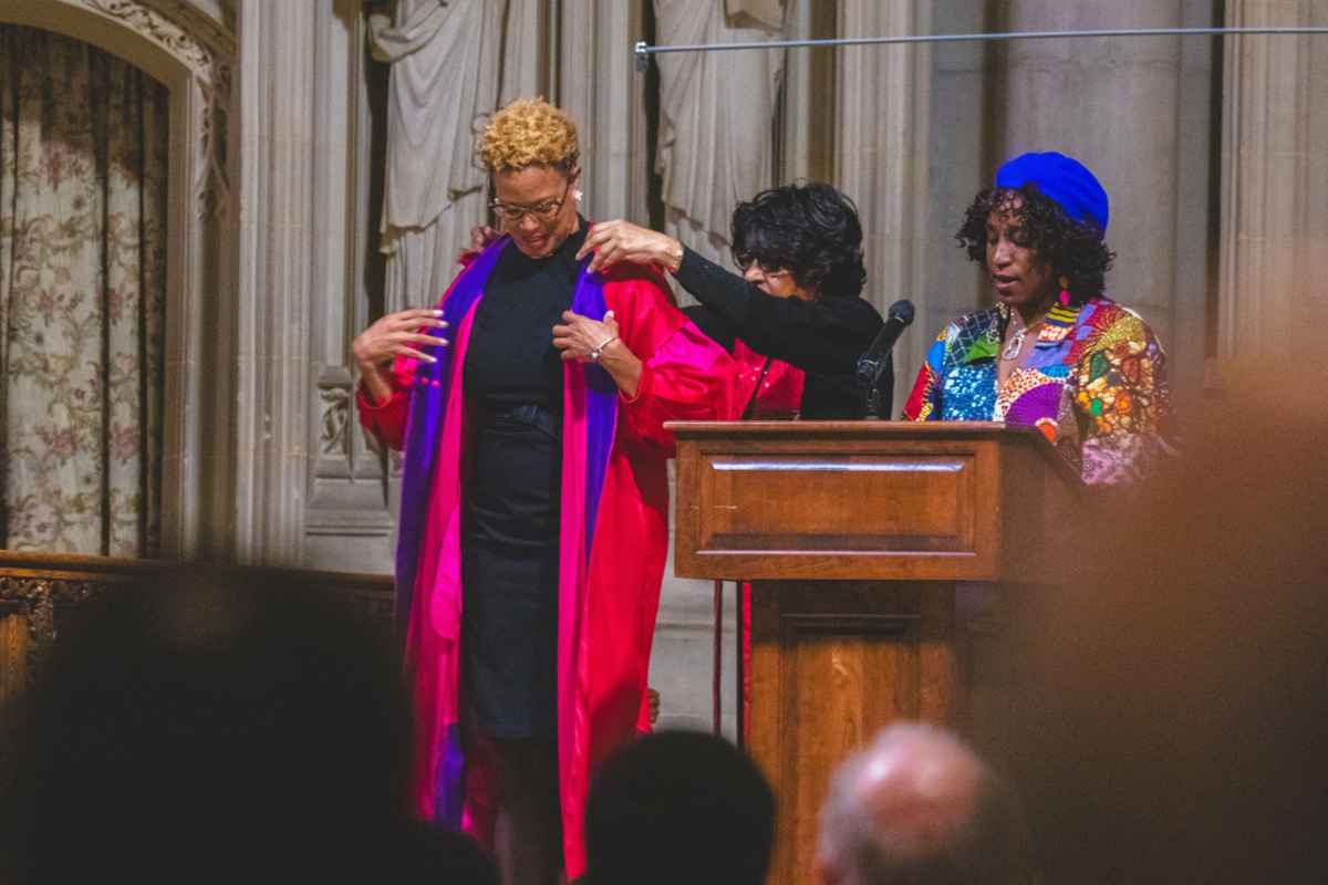 Rev Adriene Thorne receives a robe while being installed minister at Riverside Church in New York.