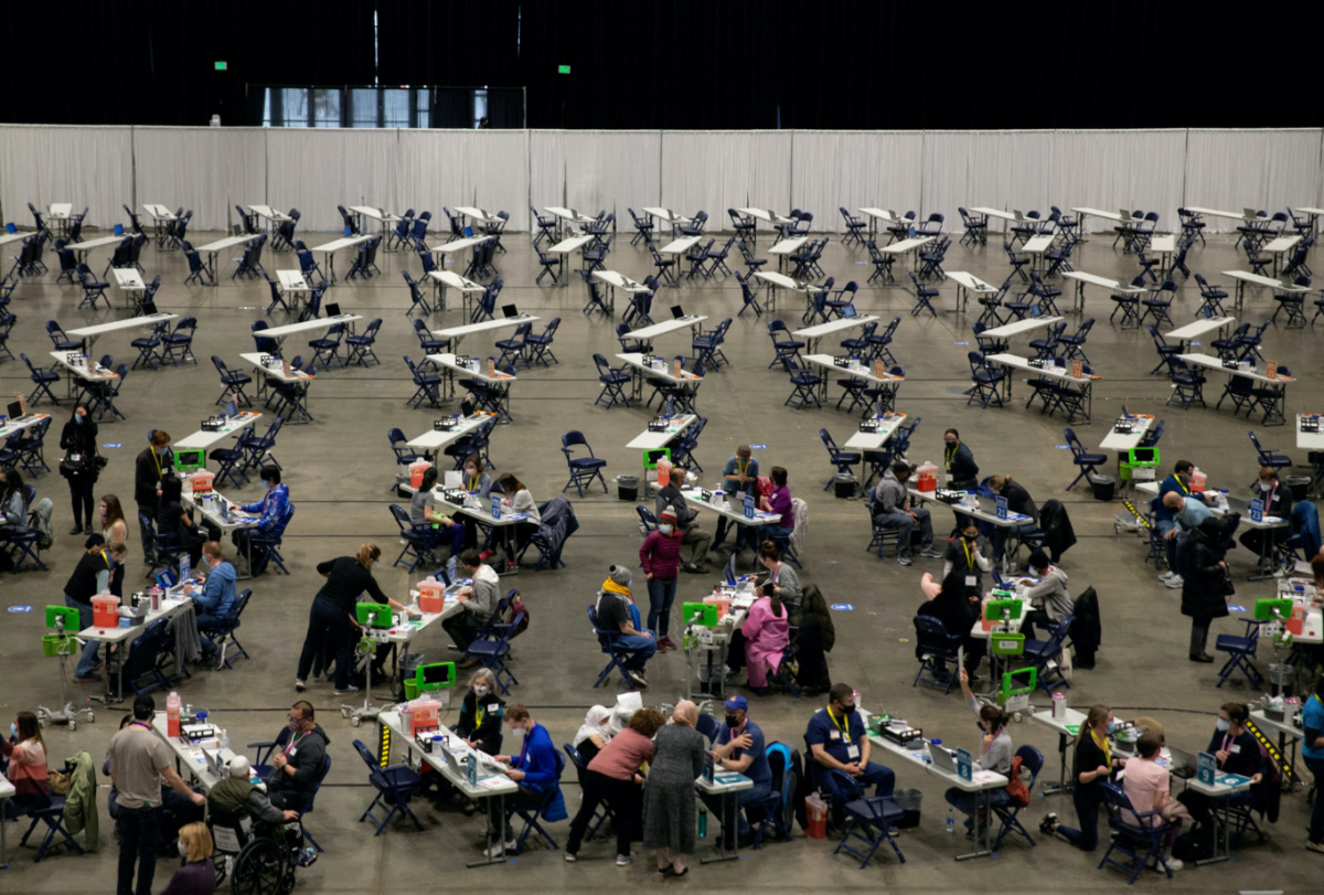 People receive their coronavirus disease vaccines at a mass vaccination site at Lumen Field Event Center in Seattle, Washington, US, on 13th March, 2021