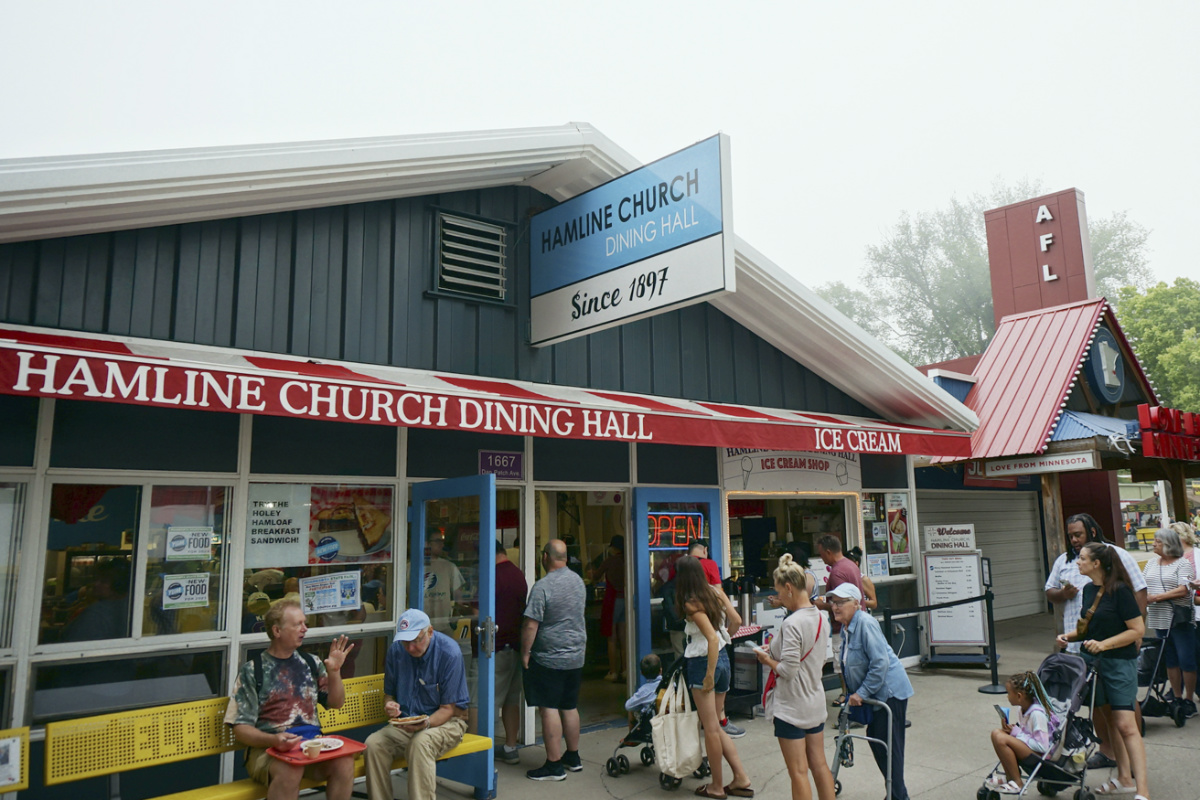A line for breakfast runs down the block outside the popular Hamline Church Dining Hall on the opening day of the Minnesota State Fair in Falcon Heights, Minnesota, on Thursday, 24th August, 2023.