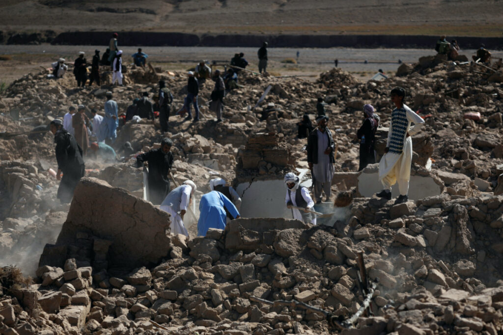 People search for survivors amid the debris of a house that was destroyed by an earthquake in the district of Zinda Jan, in Herat, Afghanistan, on 9th October, 2023