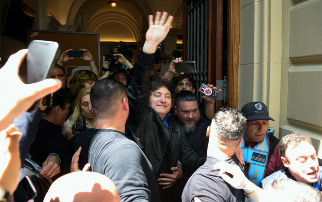 Argentina's presidential candidate Javier Milei greets supporters, outside of a polling station, during Argentina's presidential election, in Buenos Aires, Argentina, on 22nd October, 2023