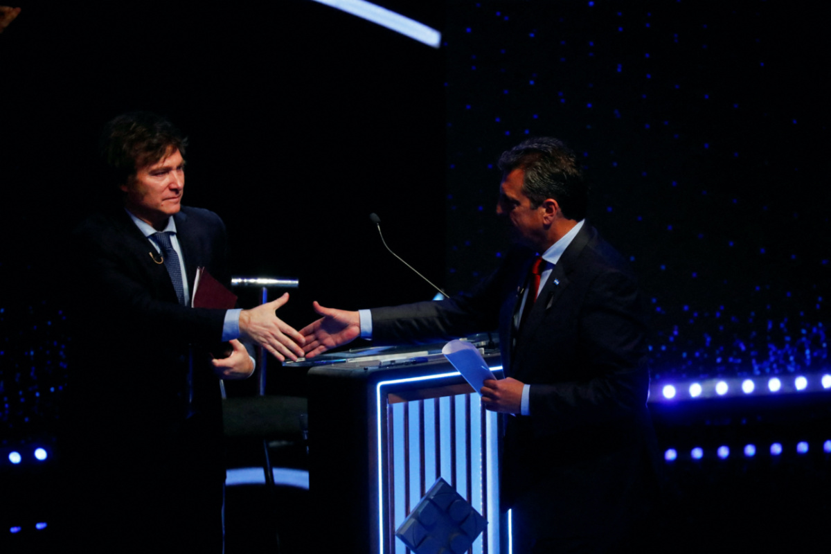 Argentine Presidential candidates Sergio Massa and Javier Milei shake hands as they attend the presidential debate ahead of the 22nd October general elections, at the University of Buenos Aires' Law School, Argentina, on 8th October, 2023