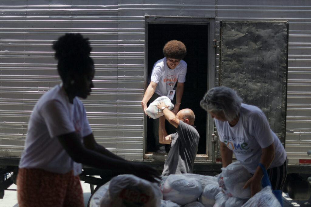 Acao da Cidadania NGO workers load a truck with food donations, as part of "Natal sem Fome", a solidarity fundraising campaign that takes food to thousands of families throughout Brazil according to the NGO, in Rio de Janeiro, Brazil, on 16th December, 2022
