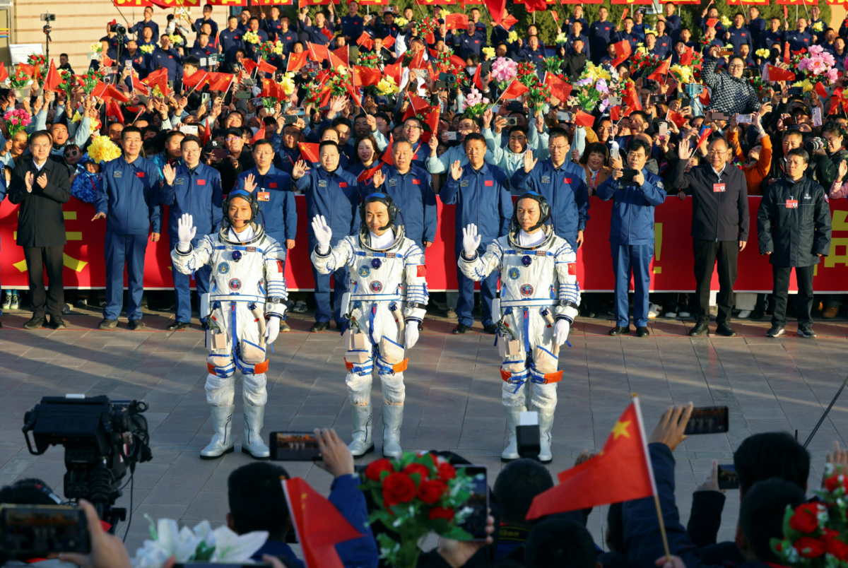 Chinese astronauts Tang Hongbo, Tang Shengjie and Jiang Xinlin attend a see-off ceremony before the launch of the Long March-2F carrier rocket, carrying the Shenzhou-17 spacecraft for a crewed mission to China's Tiangong space station, at Jiuquan Satellite Launch Center near Jiuquan, Gansu province, China on 26th October, 2023
