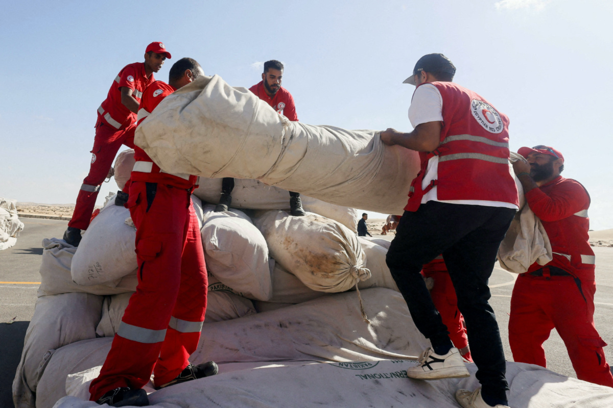 Egyptian Red Crescent members coordinate aid for Gaza, after United Nations Secretary-General Antonio Guterres visited the Rafah border crossing between Egypt and the Gaza Strip, at Al Arish Airport, Egypt, on 20th October, 2023