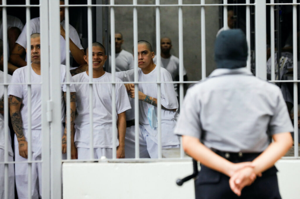 A warden watches inmates inside their cell, during a tour in the "Terrorism Confinement Center" complex, which according to El Salvador's President, Nayib Bukele, is designed to hold 40,000 inmates, in Tecoluca, El Salvador, on 12th October, 2023
