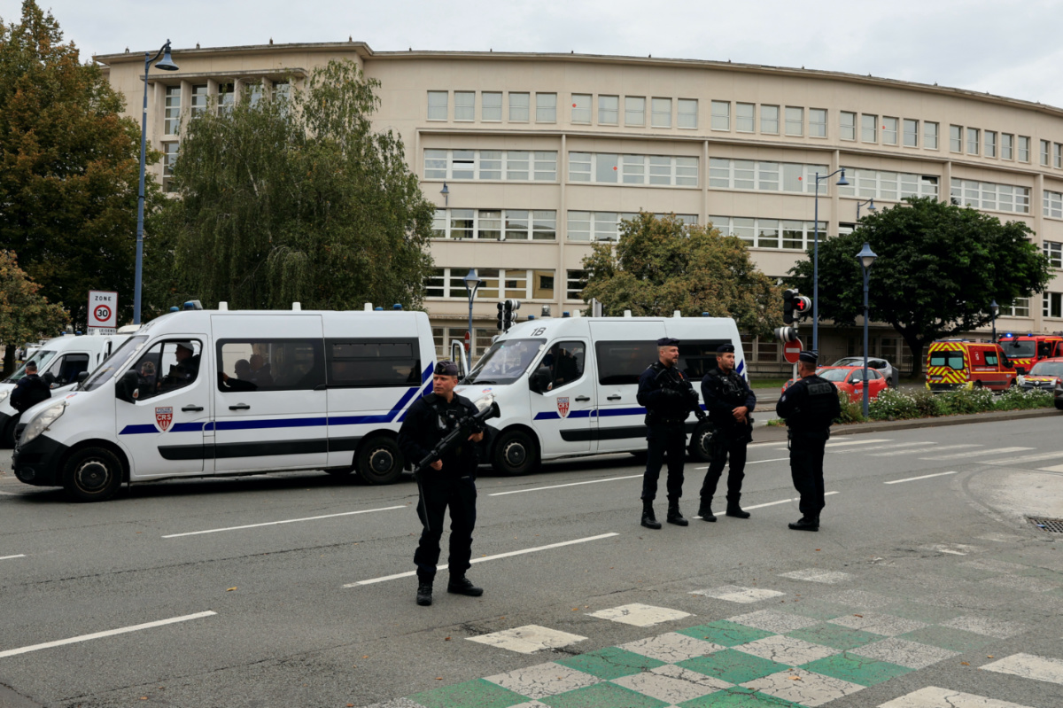 French police secure the area after a teacher was killed and several people injured in a knife attack at the Lycee Gambetta-Carnot high school in Arras, northern France, on 13th October, 2023.