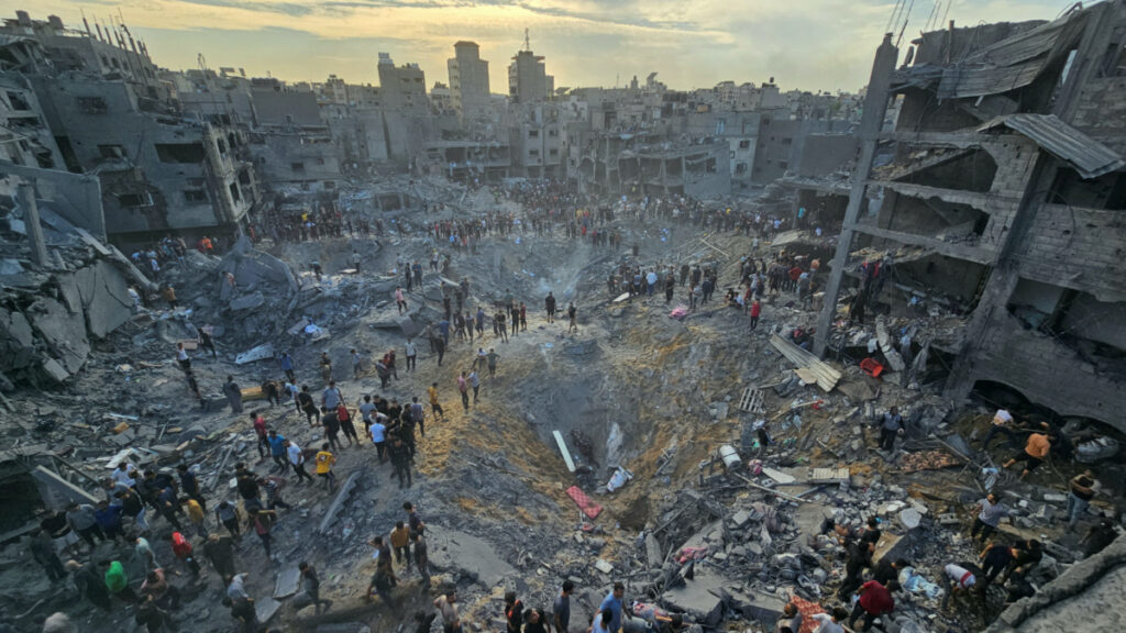 Palestinians search for casualties at the site of Israeli strikes on houses in Jabalia refugee camp in the northern Gaza Strip, on 31st October, 2023