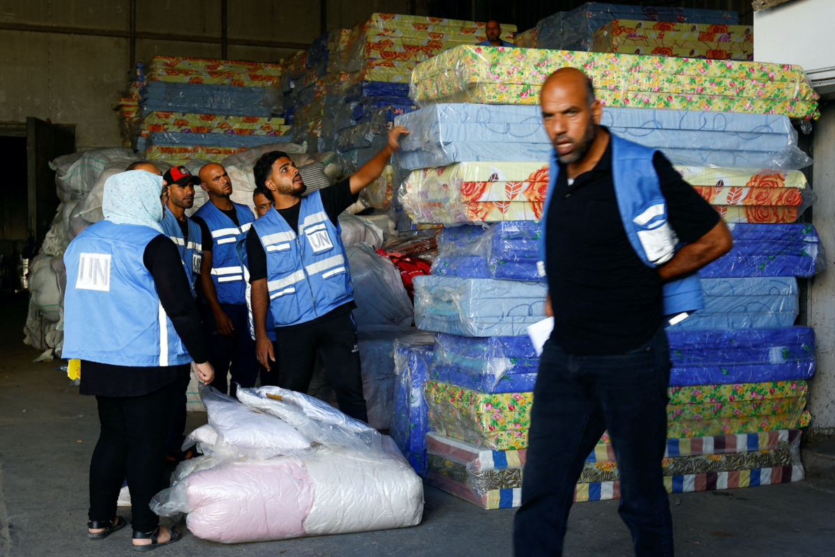 Workers sort aid to be distributed to Palestinians, as the conflict between Israel and Palestinian Islamist group Hamas continues, at a United Nations-run facility, in Khan Younis in the southern Gaza Strip, on 26th October, 2023.