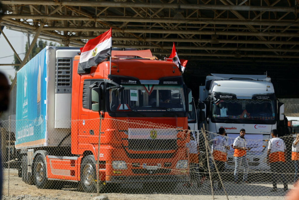 Trucks carrying aid arrive at the Palestinian side of the border with Egypt, as the conflict between Israel and Palestinian Islamist group Hamas continues, in Rafah in the southern Gaza Strip, on 21st October, 2023