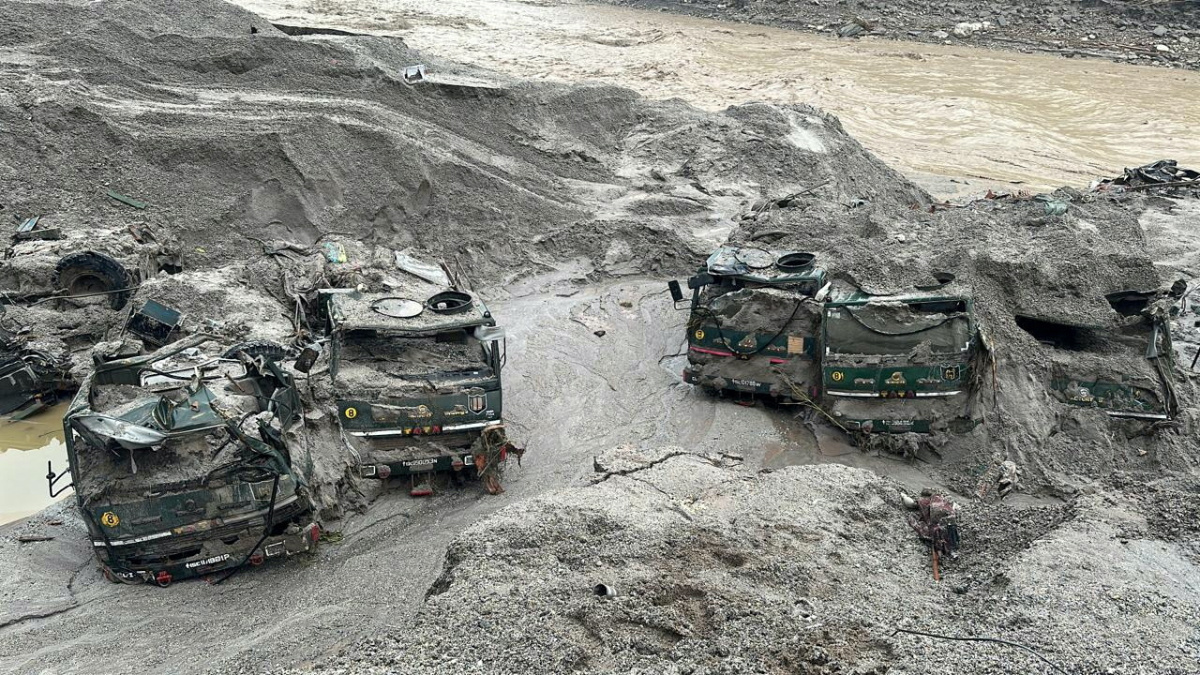 Trucks buried in mud are seen in an area affected by flood in Sikkim in this undated handout image released by the Indian Army on 5th October, 2023.