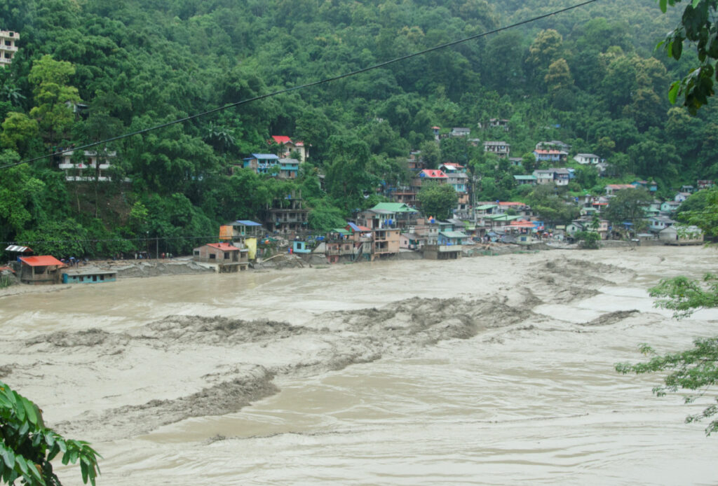 Rising water levels of the Teesta river flows along the houses at the bank of the river during the flood at Teesta Bazaar in Kalimpong District, West Bengal, India, on 4th October, 2023
