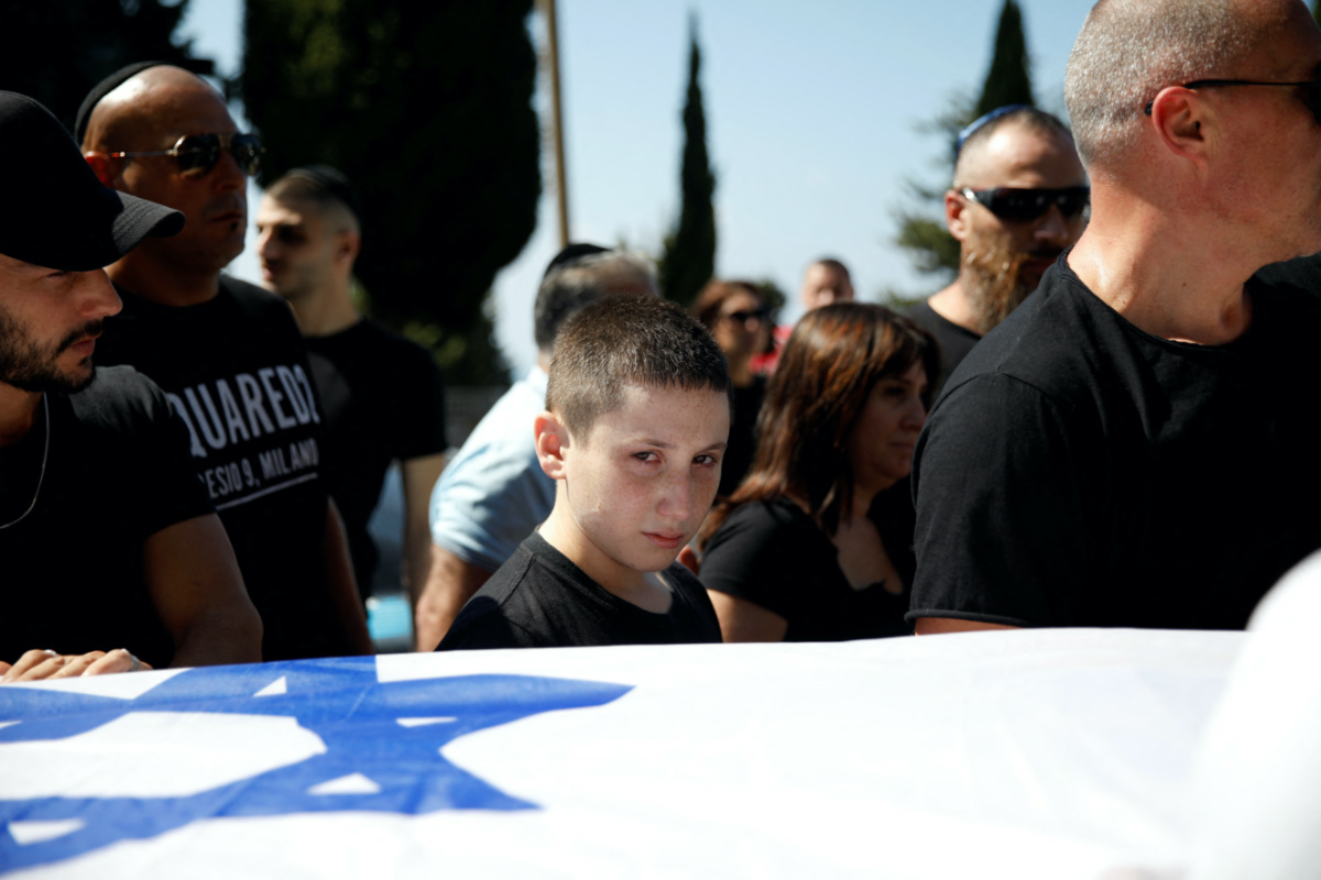 A little boy mourns Daniella Dana Petrenko, from Haifa, who was killed in a deadly attack by Hamas gunmen at a festival, which she attended with her boyfriend, at her funeral in Haifa, Israel, on 13th October, 2023