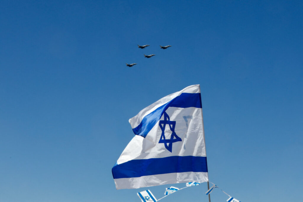 A flypast is seen over an Israeli flag as part of an aerial show organised for Israel's 75th Independence Day celebrations, in Tel Aviv, Israel, on 26th April, 2023