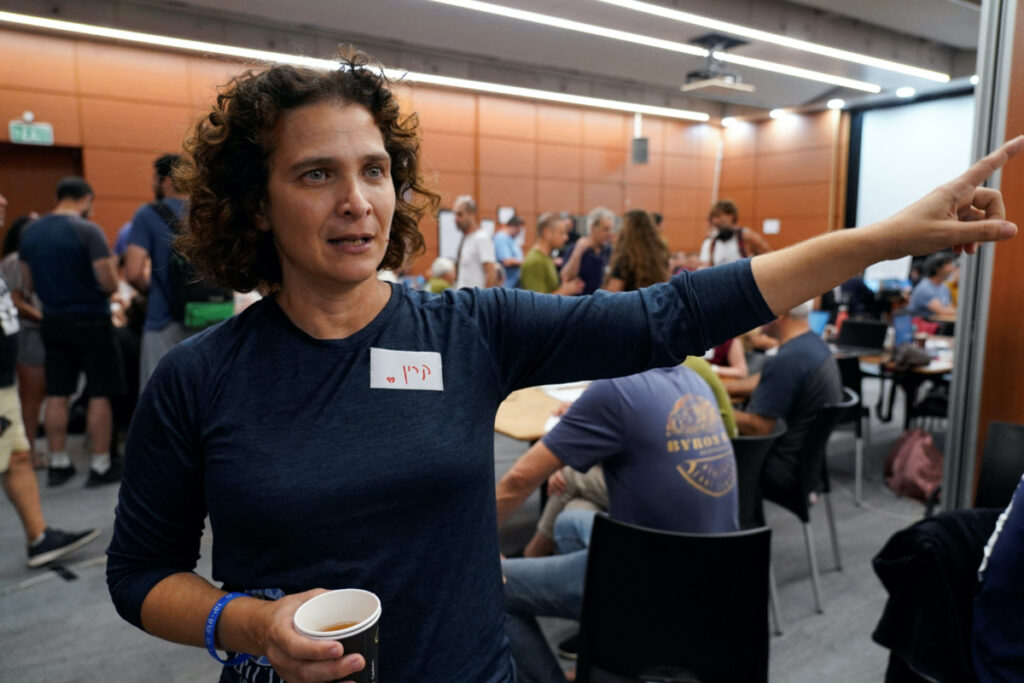 Professor Karine Nahon, head of the missing civilians war room, gestures as she describes the initiative by cyber professionals which uses cutting-edge technology to identify and locate missing people and hostages, following a deadly infiltration by Hamas gunmen from the Gaza Strip, in Tel Aviv, Israel, on 16th October, 2023