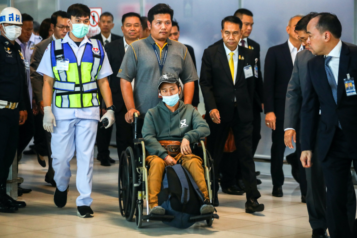 Somma, a migrant agricultural worker who was injured by a surprise attack on Israel by the Palestinian militant group Hamas, arrives at Bangkok's Suvarnabhumi Airport, Thailand, on 12th October, 2023