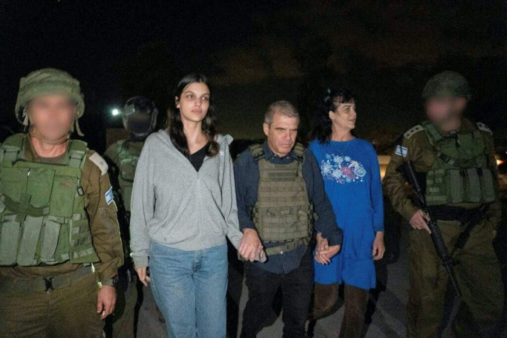 Judith Tai Raanan and her daughter Natalie Shoshana Raanan, US citizens who were taken as hostages by Palestinian Hamas militants, walk while holding hands with Brig.-Gen. (Ret.) Gal Hirsch, Israel's Coordinator for the Captives and Missing, after they were released by the militants, in response to Qatari mediation efforts, in this handout picture obtained by Reuters on 20th October, 2023.