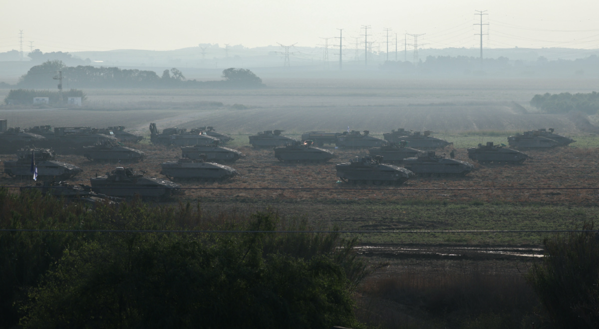 Israeli tanks and military vehicles take position near Israel's border with the Gaza Strip, in southern Israel, on 14th October, 2023