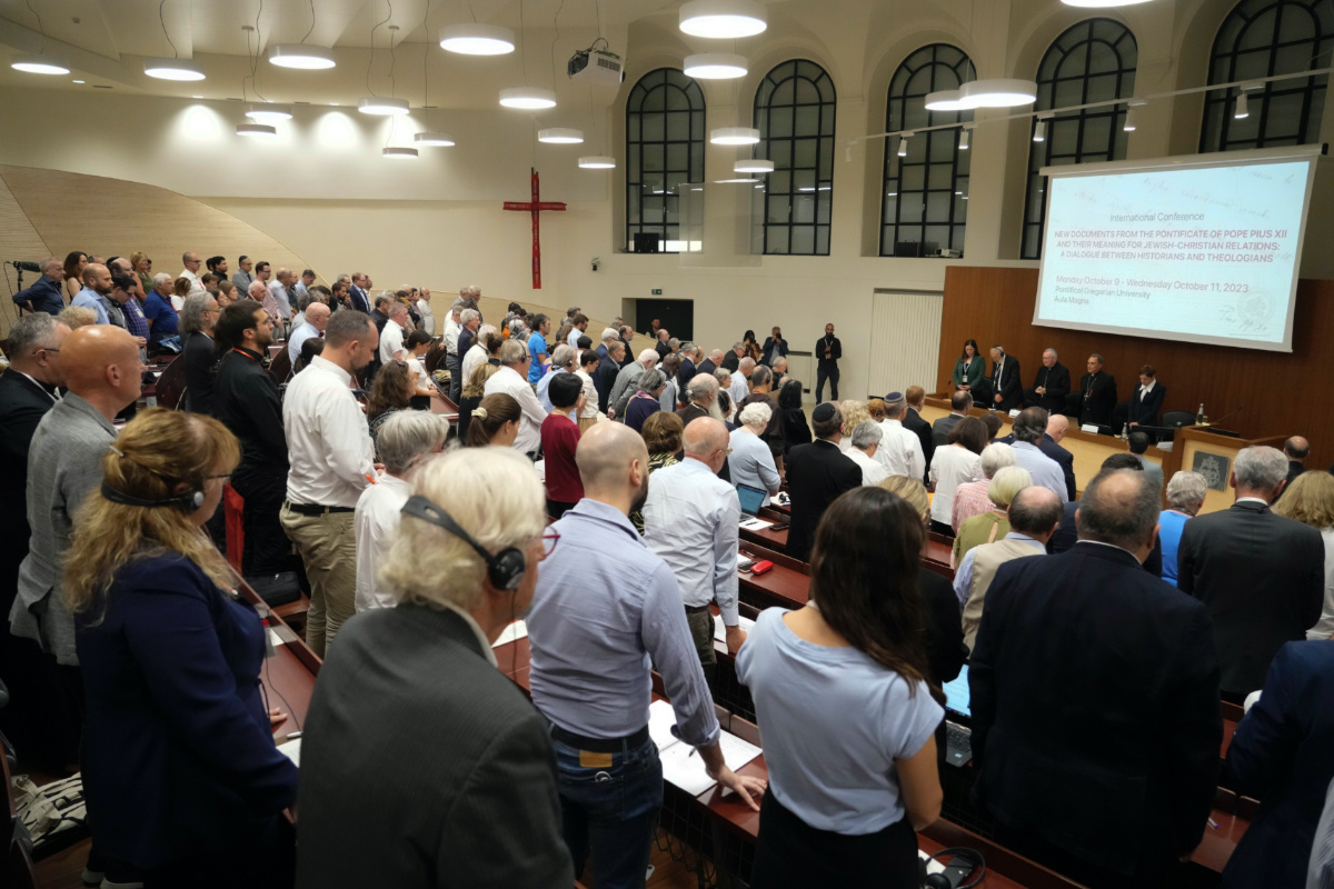 Participants at the international conference "New documents from the Pontificate of Pope Pius XII and their Meaning for Jewish-Christian Relations: A Dialogue Between Historians and Theologians", observe a minute of silence for the Israeli and Palestinian victims, as they gather at the Gregorian University in Rome, on Monday, 9th October, 2023.