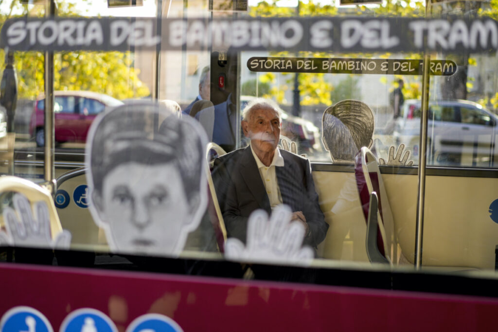Emanuele Di Porto, 92, sits on aboard a bus of the No 23 route during the inaugurating of a traveling exhibit recounting his story, in Rome, on Tuesday, 10th October, 2023