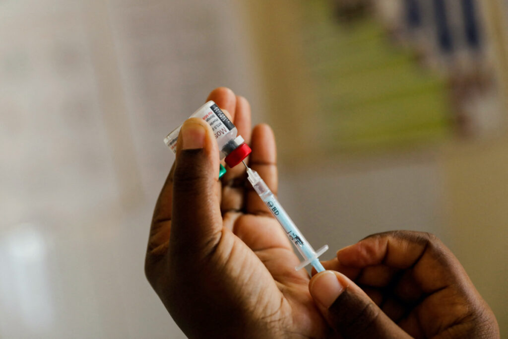 A nurse fills a syringe with malaria vaccine before administering it to an infant at the Lumumba Sub-County hospital in Kisumu, Kenya, on 1st July, 2022