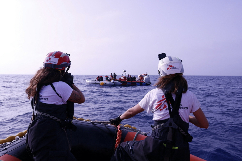Handout image obtained by Reuters, on 12th October, 2023 shows a Medicins Sans Frontiers rescue boat near a rubber boat carrying migrants from the Middle East and Africa, in the Mediterranean Sea, on 24th June, 2023.