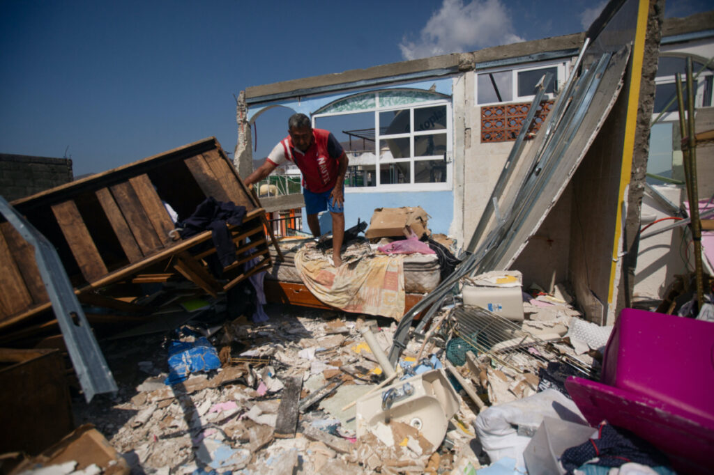 Juan Gregorio Torres walks through the rubble of his house, in the aftermath of Hurricane Otis, in the Progreso neighbourhood in Acapulco, Mexico, on 30th October, 2023