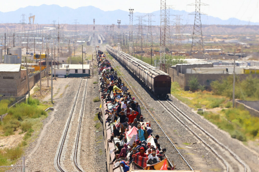Migrants travel on a train with the intention of reaching the United States, in Ciudad Juarez, Mexico, on 3rd October, 2023