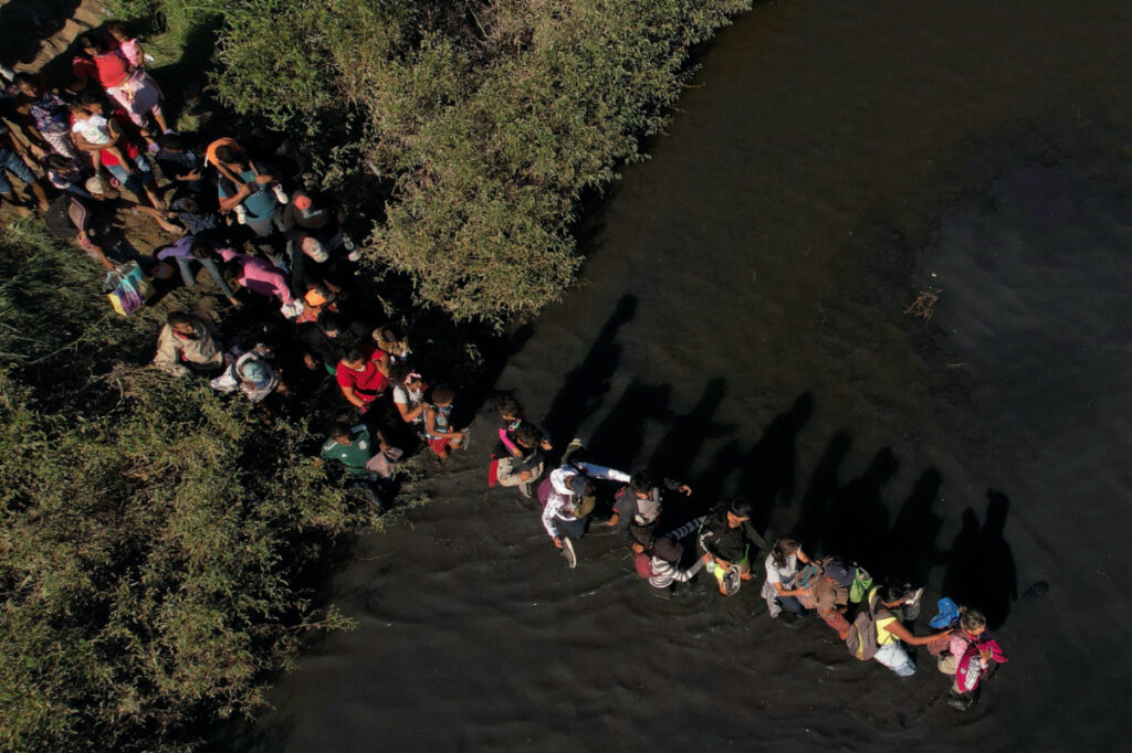 Migrants, who were stranded a day earlier near Villa Ahumada, and who are seeking asylum in the United States, cross the Rio Bravo river, as seen from Ciudad Juarez , Mexico, on 30th September, 2023