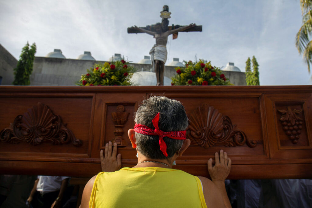 A Nicaraguan Catholic prays while blindfolded during a Good Friday procession at the Metropolitan Cathedral as the government banned Holy Week street processions this year due to unspecified security concerns, in Managua, Nicaragua on 7th April, 2023