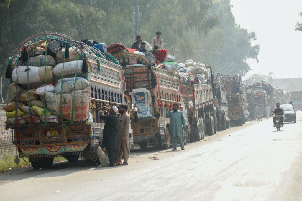 Trucks loaded with belongings are seen as Afghan refugees are returning home, after Pakistan gives the last warning to undocumented immigrants to leave, outside the United Nations High Commissioner for Refugees repatriation centres in Azakhel town in Nowshera, Pakistan on 30th October, 2023.