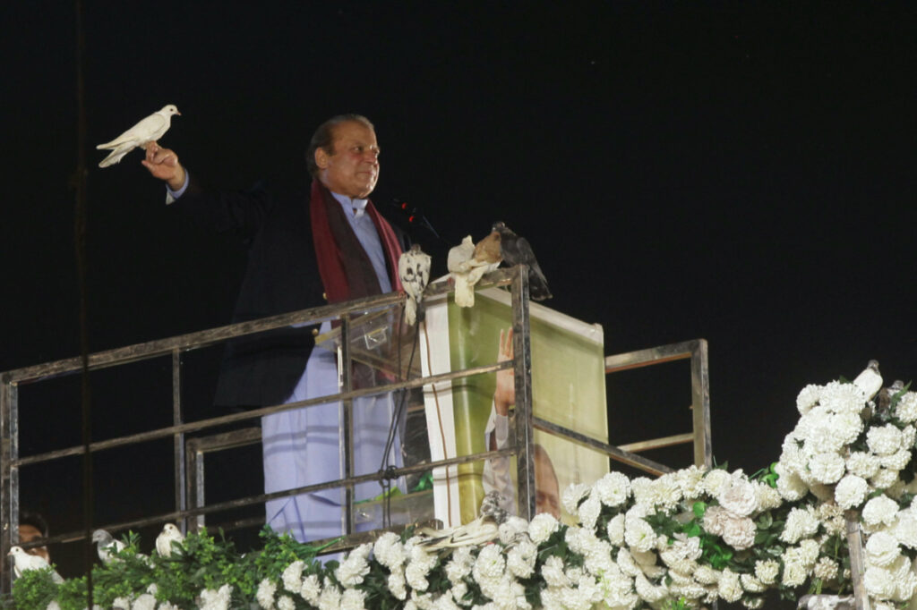 Pakistan's former Prime Minister Nawaz Sharif prepares to release a pigeon in front of supporters, following his arrival from a self-imposed exile in London, ahead of the 2024 Pakistani general election, in Lahore, Pakistan, on 21st October, 2023