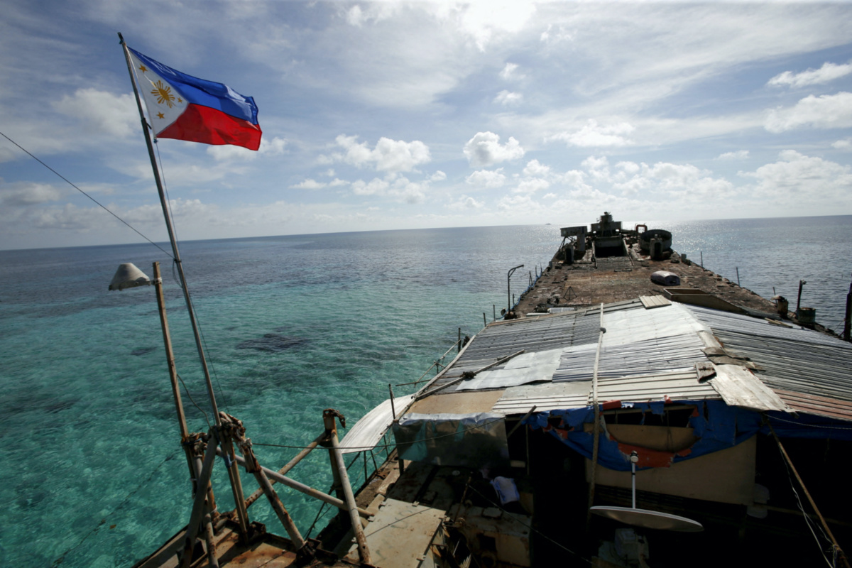 A Philippine flag flutters from BRP Sierra Madre, a dilapidated Philippine Navy ship that has been aground since 1999 and became a Philippine military detachment on the disputed Second Thomas Shoal, part of the Spratly Islands, in the South China Sea on 29th March, 2014.