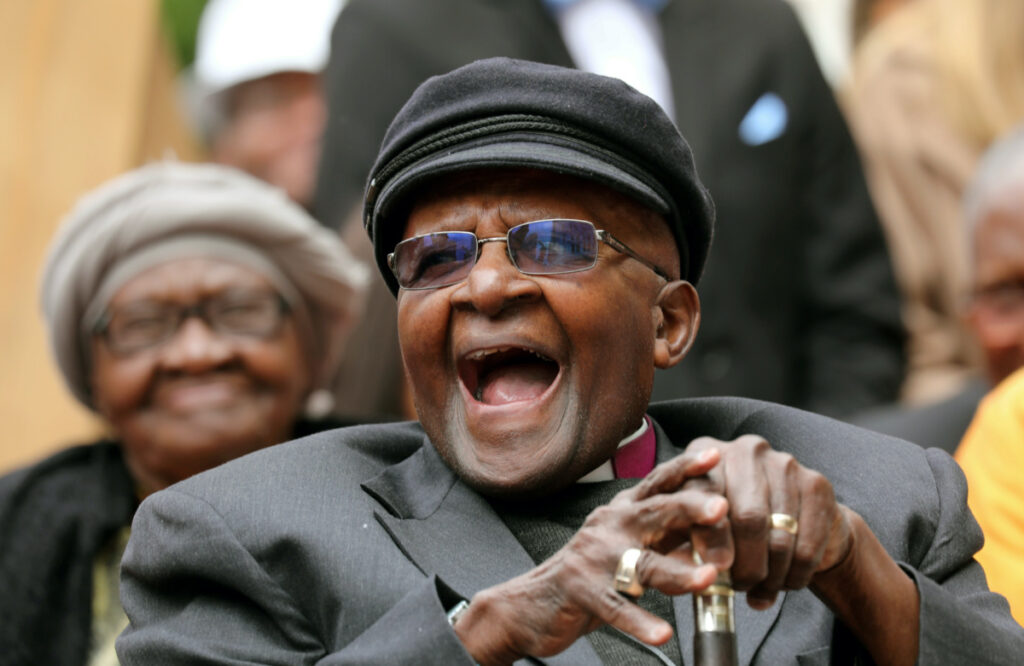 Archbishop Desmond Tutu laughs as crowds gather to celebrate his birthday by unveiling an arch in his honour outside St George's Cathedral in Cape Town, South Africa, on 7th October, 2017
