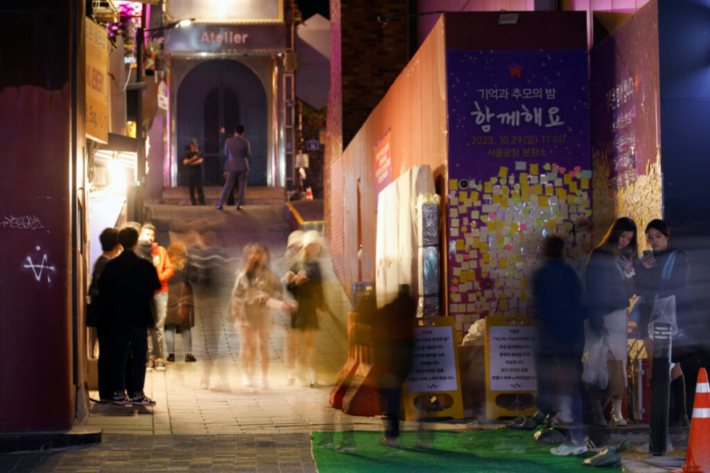People walk through an alley in Itaewon where the Halloween crowd crush occurred last year, in Seoul, South Korea, on 23rd October, 2023